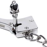 ready to open a silver stainless steel handcuffs use key